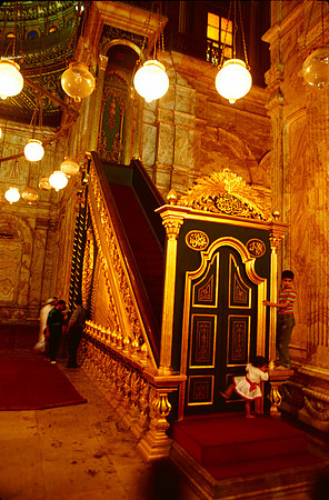 Two children play inside the Mosque.