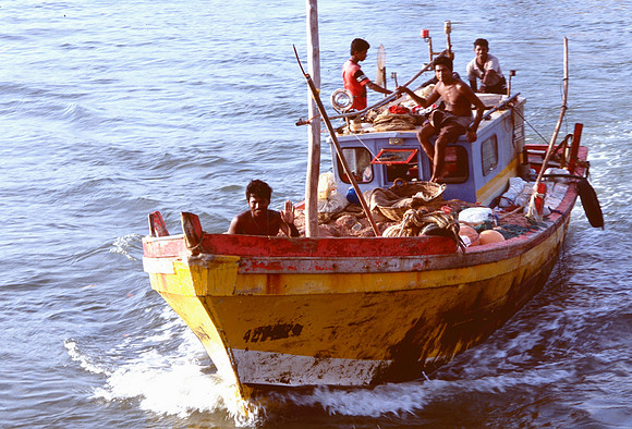 Fishermen on old boat.