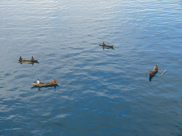 Four outrigger canoes.