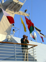 Tourist with camera on a cruise ship.