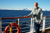 Man on cruise ship overlooking Elephant Island, Antarctica