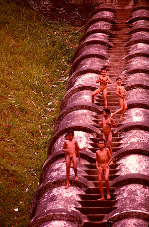 Group of young boys playing on an aquaduct in Lumbok.