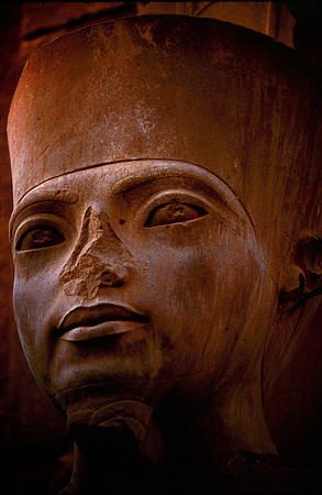 Ancient stone head in the Museum at Luxor, Egypt