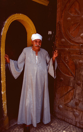 A Coptic priest holding a cross.