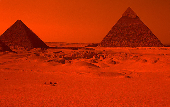 The burning hot desert surrounds the Great Pyramids.